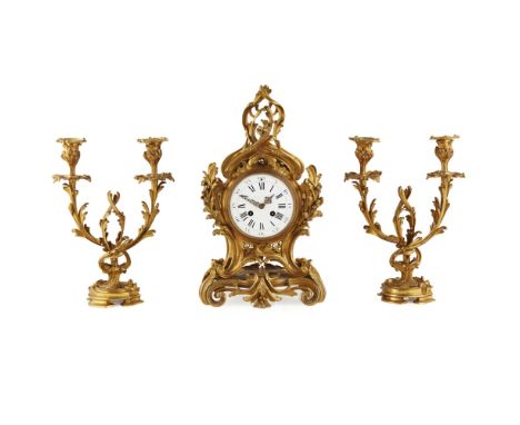 FRENCH GILT BRONZE ROCOCO STYLE CLOCK GARNITURE, LEROY ET FILS  19TH CENTURY   the signed white enamel dial with Roman and Ar