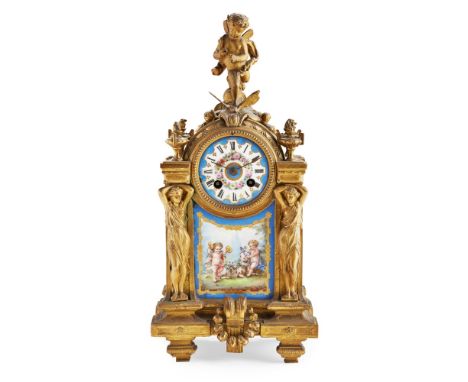 FRENCH GILT METAL AND PORCELAIN MOUNTED MANTEL CLOCK
19TH CENTURY  the circular painted porcelain Roman number dial set in a 
