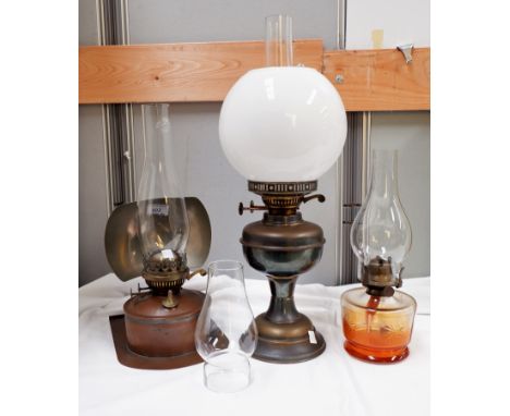 A 19th century oil lamp with reflector, 2 others similar 