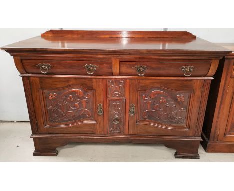 An Art Nouveau period walnut sideboard base with 2 frieze drawers and twin carved cupboard , drawers under
