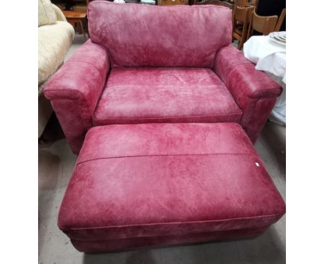 A modern 2 piece lounge suite in pink suede, comprising 2 seater settee and pouffe 