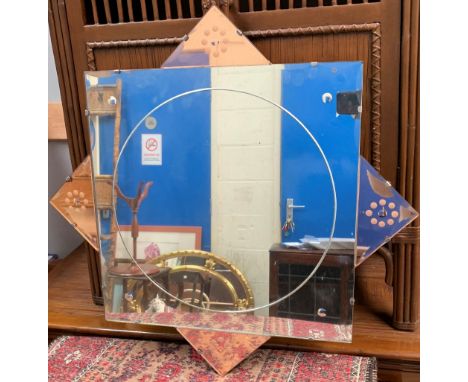 An Art Deco wall mirror in peach glass frame 