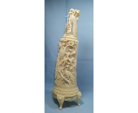 An early 20th century Indian ivory covered vase, the body finely pierced and with relief decoration of peacocks and exotic bi