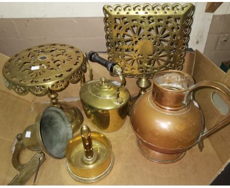 A 19th century brass kettle, 2 pierced brass trivets, a "French Art" stand, a brass bell on wall bracket 