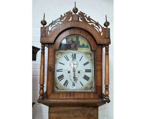 An early 19th century mahogany longcase clock, the hood with 3 brass finials, fretted pediment and turned side columns, simil