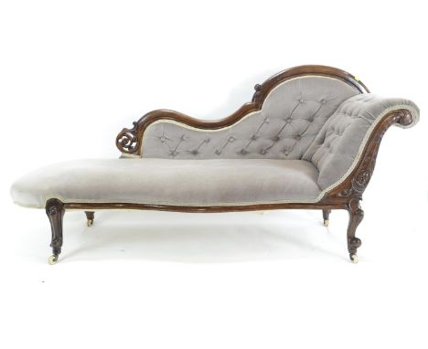 Mahogany carved button backed chaise longue, with later upholstery. L184cm D67cm h90cm 