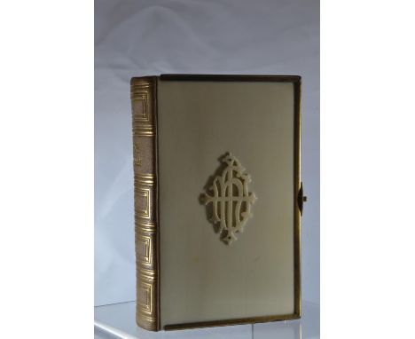 A compact Victorian gilt brass bound church services book containing the Book of Common Prayer etc. with the New Testament of