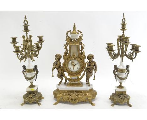 C20 reproduction of a C19 French style gilt brass mantle clock with garniture. Likely produced by Farbel Fonderie D'Arte, wit