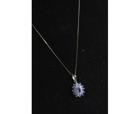 14ct white gold, tanzanite & diamond cluster pendant & chain, pendant length including bale 21mm, chain circumference 460mm, 