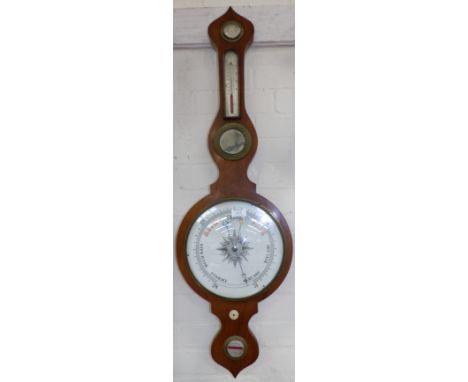 An early 19th century mercury column barometer in onion top mahogany case, with thermometer, mirror and level