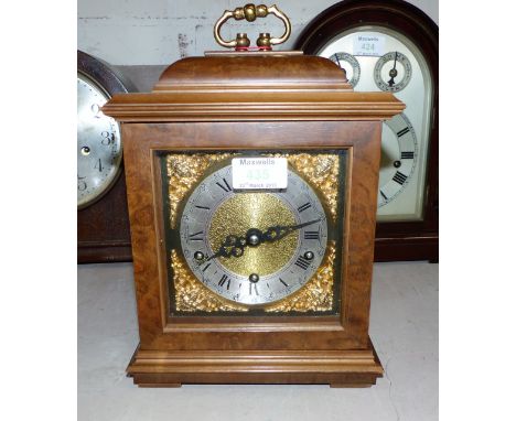 An 18th century style walnut bracket clock with brass dial and chiming movement
