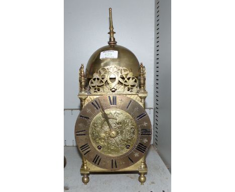 A large early 20th century brass striking lantern clock