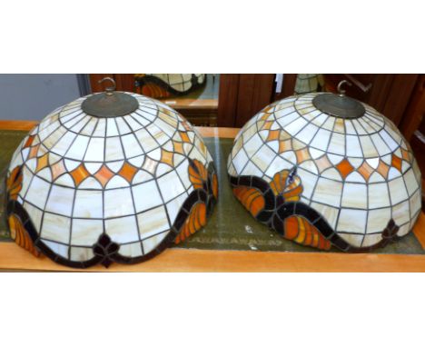 A set of 3 Tiffany style coloured and leaded glass lamp shades
