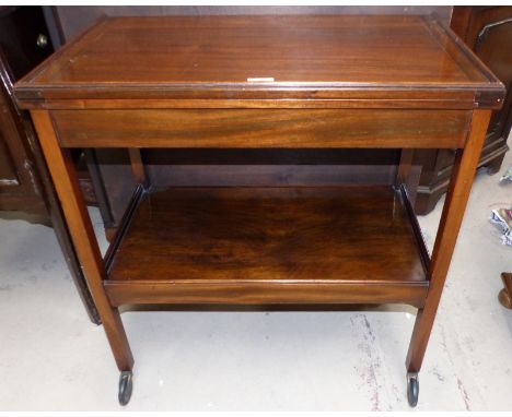 A 1950's mahogany 2 tier fold over-card table/tea trolley