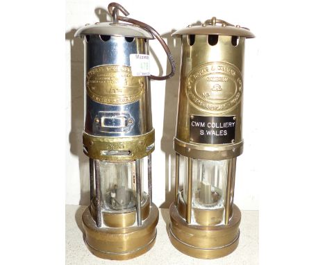 An early 20th century brass and steel miner's lamp by Thomas & Williams, Aberdare; another similar lamp; ornamental brassware