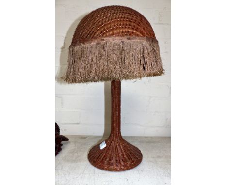 A 1920's Lloyd Loom table lamp with original gilt spray red paint finish and silk fringe, 19"