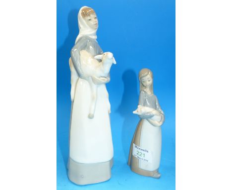 Two Lladro figures:  girl with lamb, and girl with pig