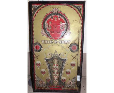 An early 20th century bagatelle type board "Trik-E-Shot"
