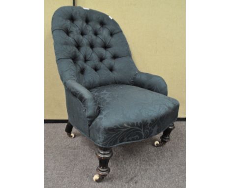 A green button back chair