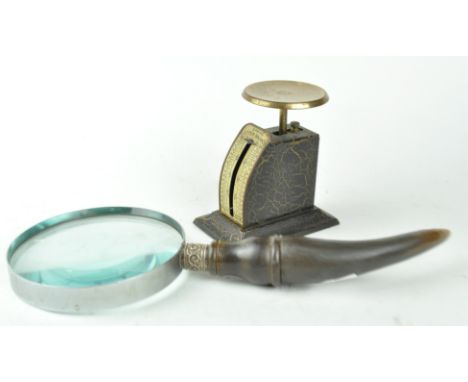 A magnifying glass and postal scales