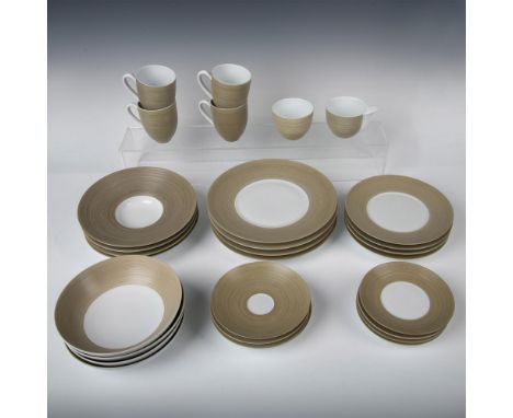 Contemporary design on white porcelain with embossed ridges. Pieces included: 1 creamer, 1 sugar bowl, 4 cups, 4 saucers 6.5"