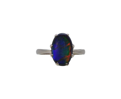 A black opal ring, approximately 12.2 x 8mm, size L½, stamped '18CT', weight 2.8g