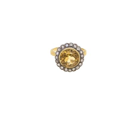 A citrine and diamond cluster ring, head diameter 14.9mm, size K, unmarked, tested as 18ct gold with white metal settings, we