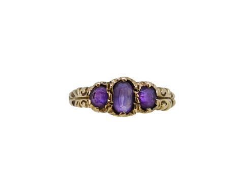 A 9ct gold amethyst three stone ring, width 7.3mm, size L½, hallmarked 9ct gold, weight 2.6g