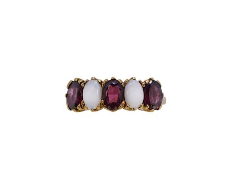 A 9ct gold garnet and opal ring, width 7mm, size O½, hallmarked 9ct gold, weight 3.2g