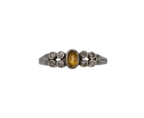 An 18ct gold citrine and diamond ring, width 5.5mm, size L½, hallmarked 18ct gold, weight 2.6g