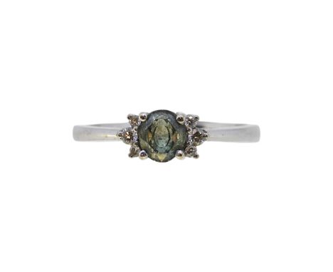 A green sapphire and diamond ring, size M, stamped 'K18', weight 3g