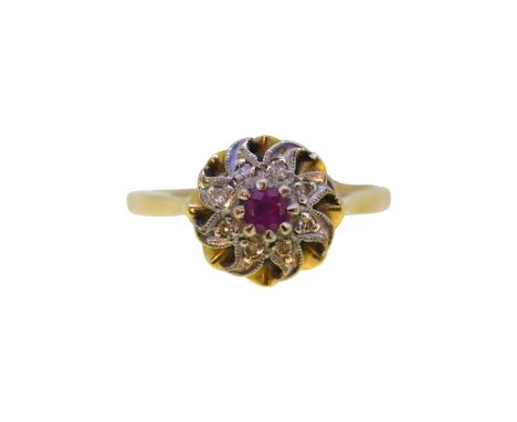 An 18ct gold ruby and diamond cluster ring, head diameter 10.5mm, size N½, hallmarked 18ct gold, weight 3.6g