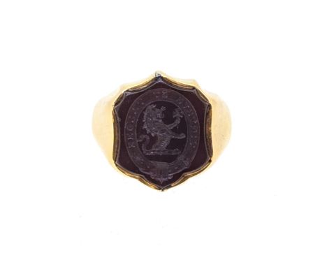 A hardstone intaglio ring, carved with a family crest, head dimensions 17.3 x 15.1mm, size L½, tested as 18ct gold, weight 11