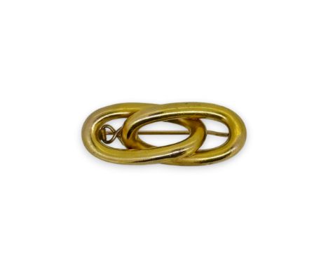 A figure of eight style brooch, dimensions 3.5 x 1.5cm, stamped '585', weight 4.9g, cased