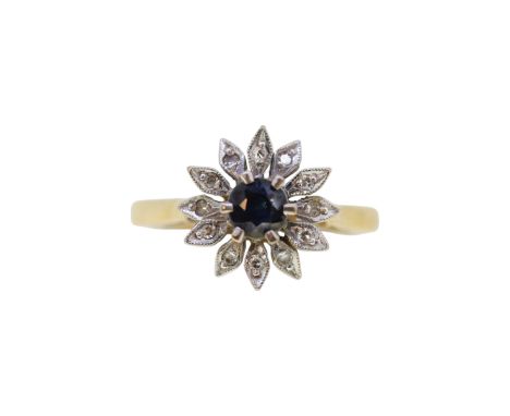 A sapphire and diamond cluster ring, head diameter 11.3mm, size K, stamped '18CT', weight 3.6g