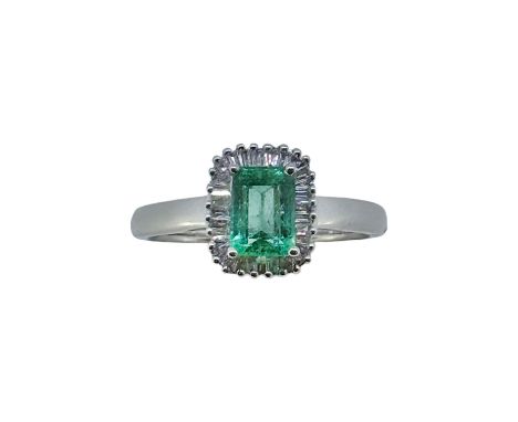 An 18ct gold emerald and diamond cluster ring, octagonal emerald, approximately 7.05 x 5.05mm, estimated approximate weight 0