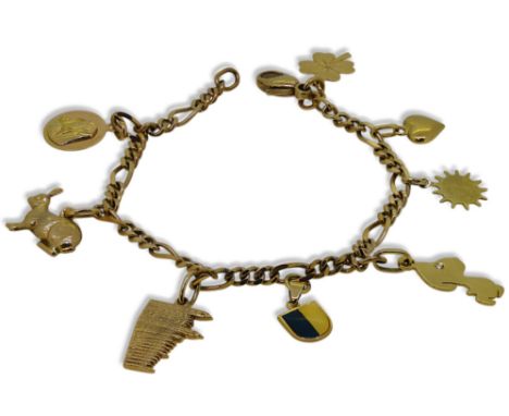 A charm bracelet, five charms stamped '750' and three charms hallmarked or assessed as 9ct gold, figaro link chain, length 17