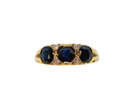 An 18ct gold sapphire and diamond ring, width 6.3mm, size L½, hallmarked 18ct gold, weight 4.3g