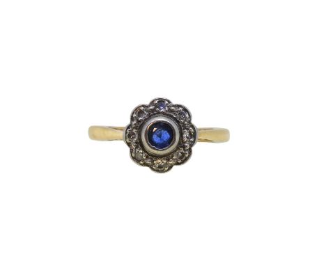 A sapphire and diamond cluster ring, head diameter 9.8mm, size M, stamped '18CT PLAT', weight 2.9g