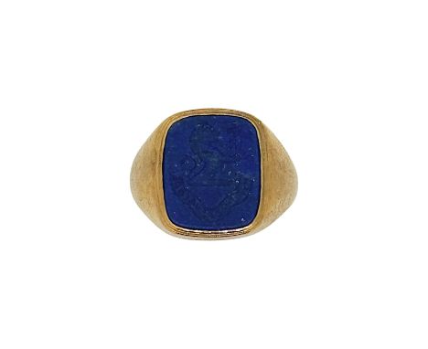 A lapis lazuli intaglio ring, carved with a family crest, head dimensions 13.8 x 13mm, size I, stamped '14K', weight 6.3g