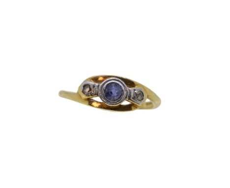 An 18ct gold sapphire and diamond three stone crossover ring, width 6.1mm, size I, hallmarked 18ct gold, weight 2g