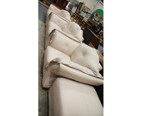 Light pink leather three piece suite comprising three and two seater settees, armchair and pouffe. This lot is not available 