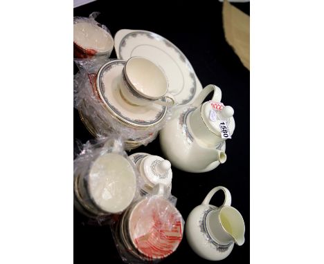 Twenty two piece Royal Doulton tea service in the Albany pattern, 1986 never used. This lot is not available for in-house P&a