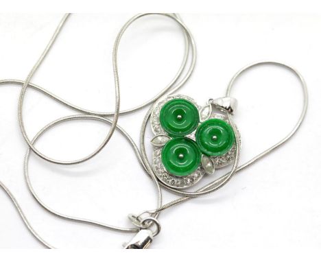 18ct white gold diamond and jade set pendant on an 18ct white gold chain, L: 43 cm, 8.3g pendant size 20mm. P&amp;P Group 1 (