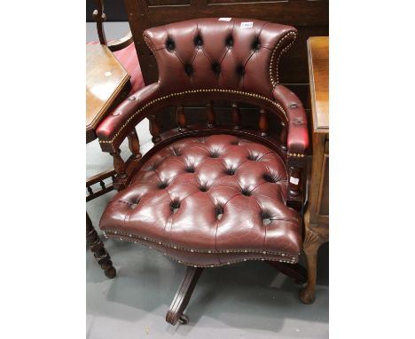 Oxblood red leather button back captains swivel chair. This lot is not available for in-house P&amp;P 