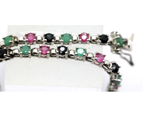 Modern silver ruby, emerald and sapphire set bracelet, L: 20cm. P&amp;P Group 1 (£14+VAT for the first lot and £1+VAT for sub