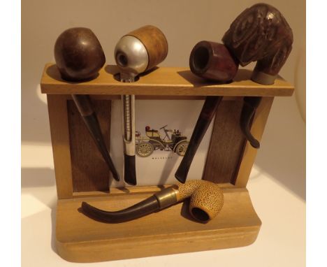 1970s pipe rack and five pipes including Comet and Falcon 