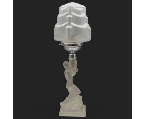 Art Deco moulded glass table lamp. The lamp supported by a maiden, on a rocky circular base, with a matching glass shade, H46