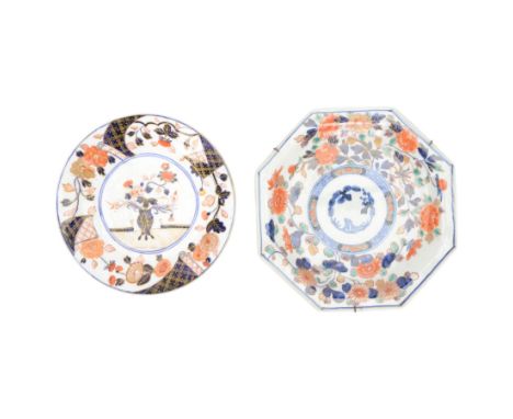 Japanese imari plate, of octagonal form, decorated with floral sprigs around a floral and diaper design, together with anothe