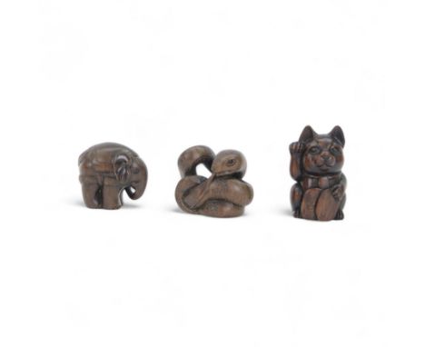 Three Japanese netsuke, modelled as Maneki-neko for luck, Zou for wisdom and strength and Hebi for good fortune, and fertilit